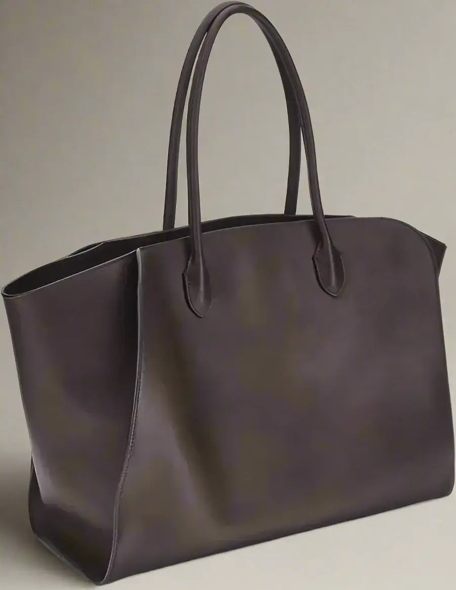 Brown leather tote bag on a white background