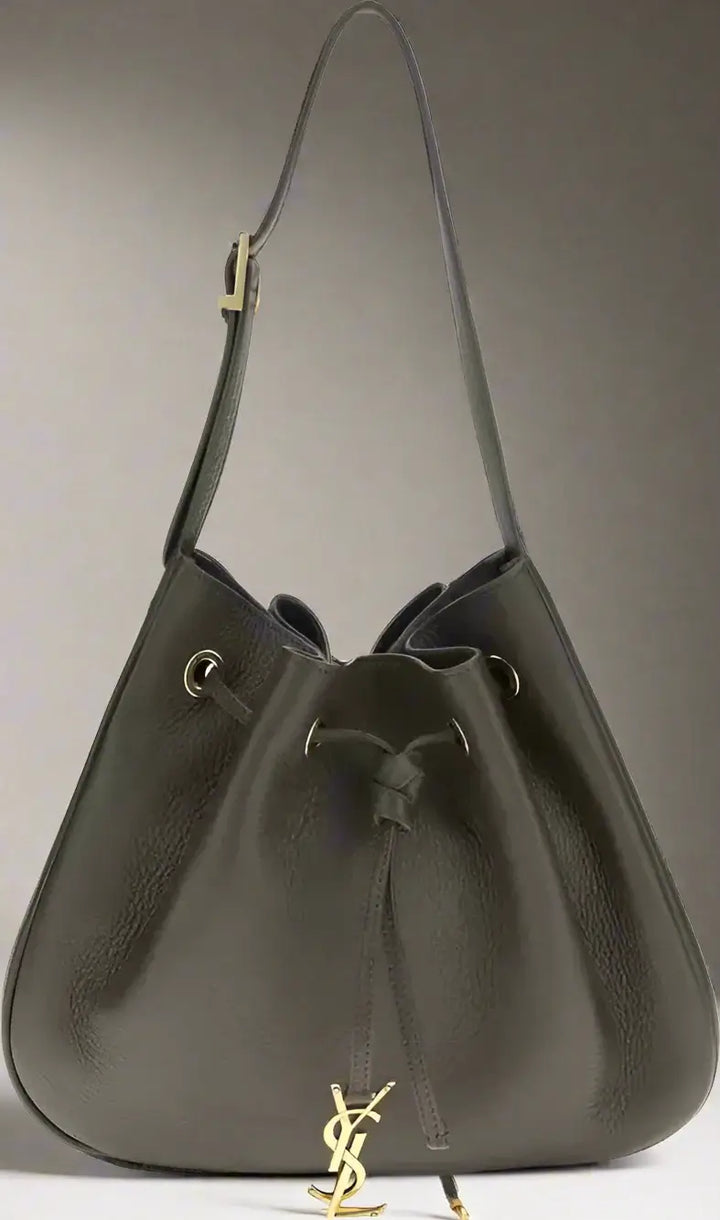 Dark brown leather handbag with drawstring closure on a white background