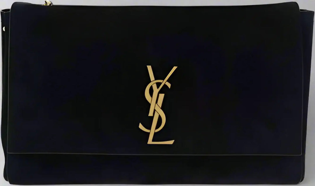 Black clutch bag with gold logo on a black background