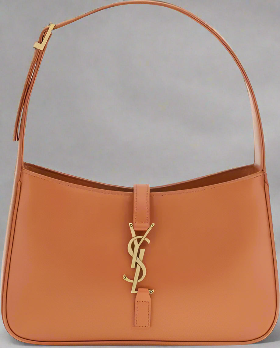 Brown handbag with a gold logo on a white background