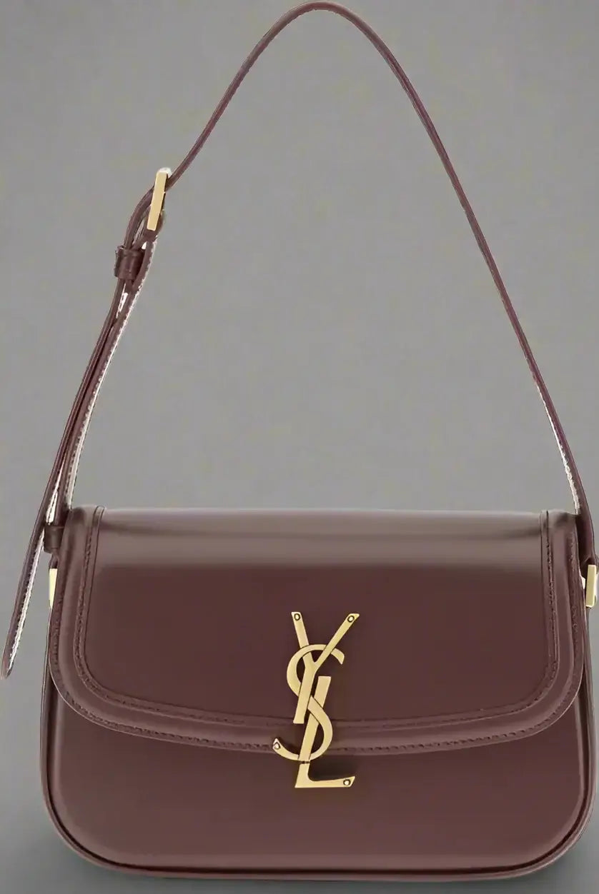 Brown handbag with gold logo on a white background