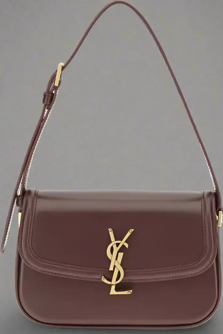 Brown handbag with gold logo on a white background