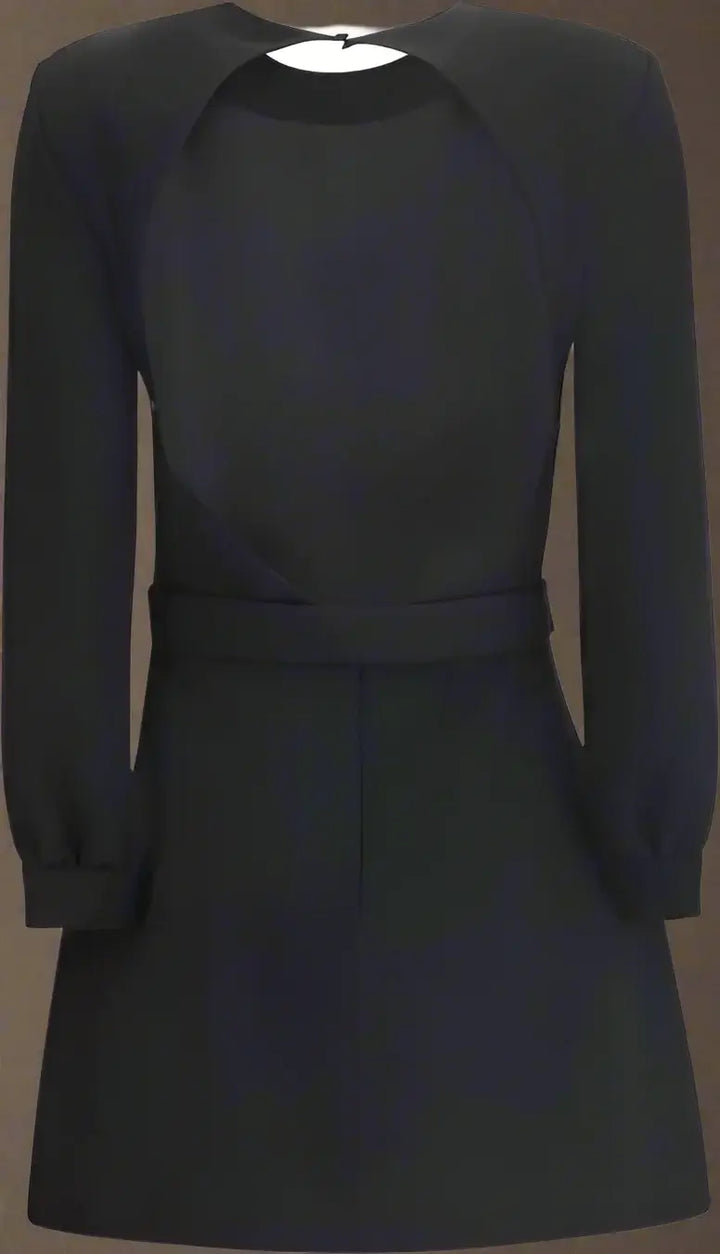 Black dress with long sleeves on a plain background