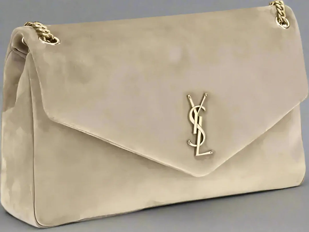 Beige handbag with gold chain and logo on a white background