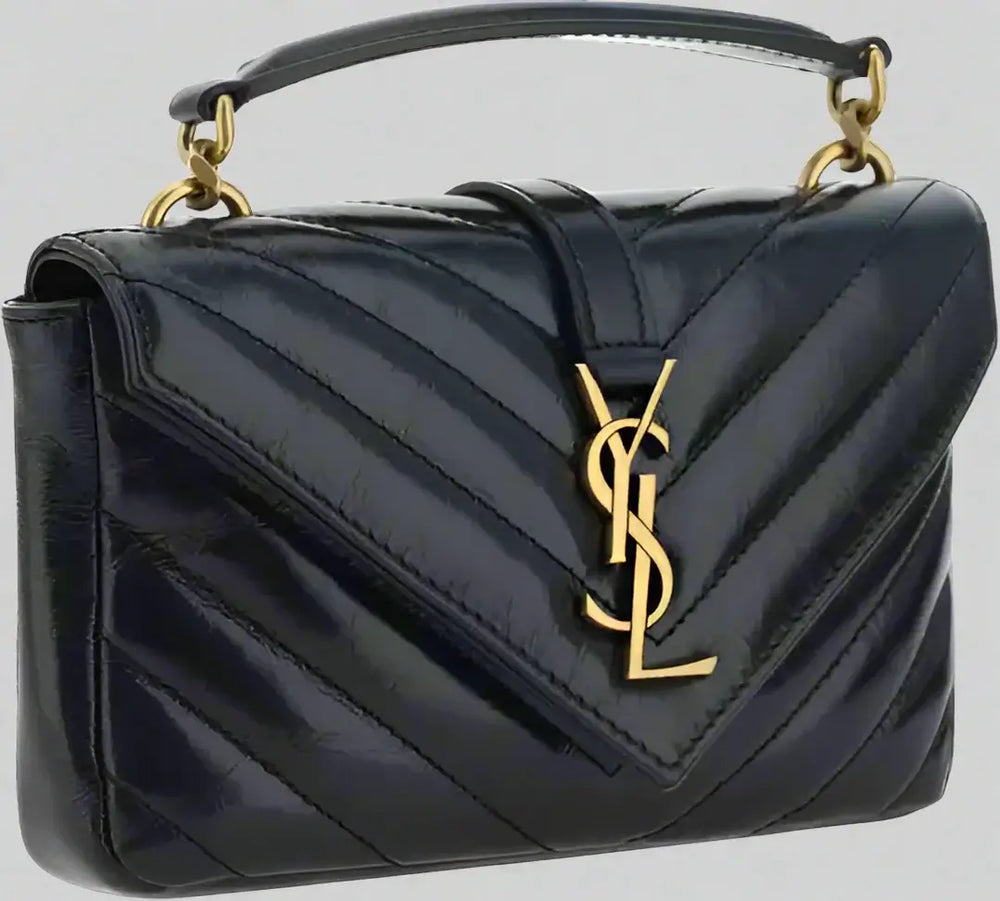 Black quilted handbag with gold logo on a white background