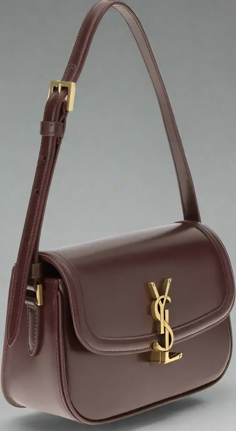 Brown handbag with gold YSL logo on a white background