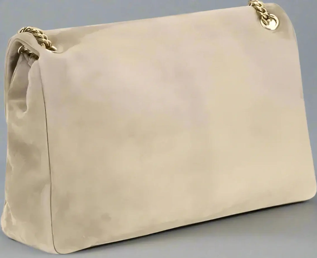 Beige handbag with gold chain strap on a white background