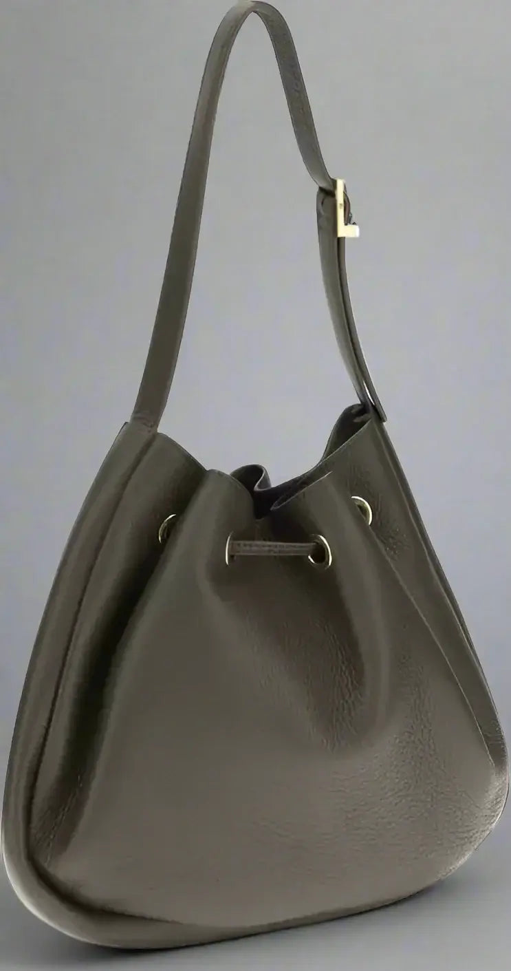 Dark brown leather handbag with a drawstring on a white background