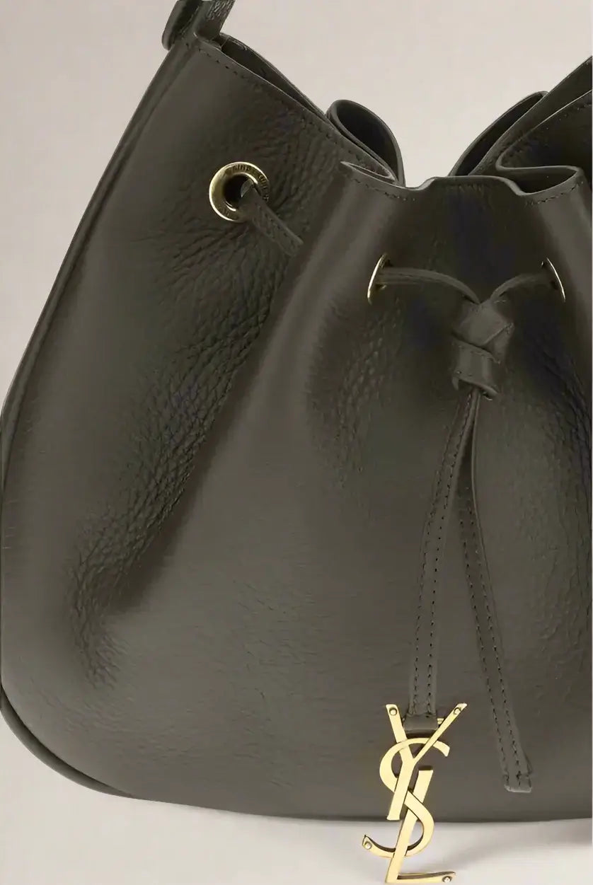 Dark brown leather drawstring bag with gold logo on a white background