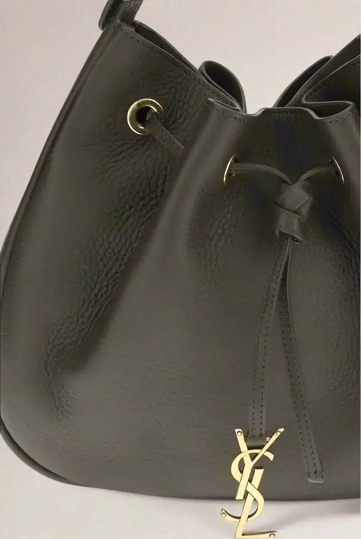 Dark brown leather drawstring bag with gold logo on a white background