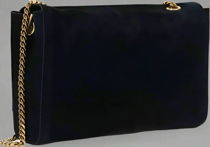 Black handbag with a gold chain strap on a white background