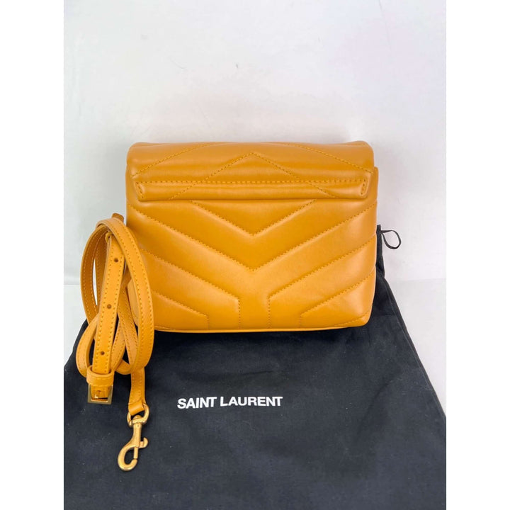 Saint Laurent Calfskin Quilted Toy Loulou Yellow Crossbody Bag with removable strap on a dust bag.