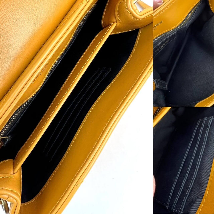 Interior view of Saint Laurent Calfskin Quilted Toy Loulou Yellow Crossbody Bag showcasing organized compartments. Luxury bags.