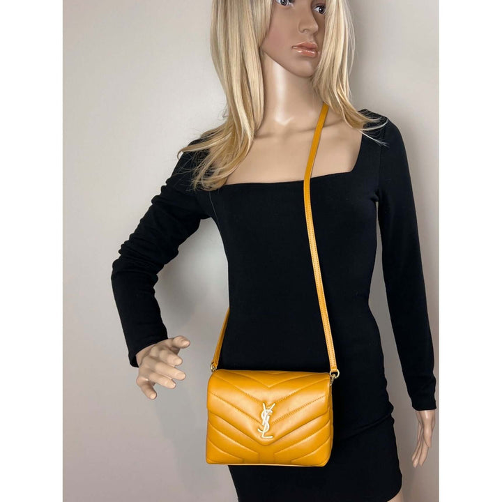 Saint Laurent Calfskin Quilted Toy Loulou Yellow Crossbody Bag worn by mannequin in stylish outfit, luxury bags.
