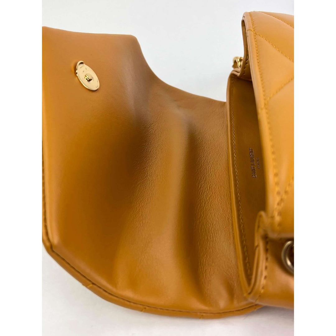 Inside view of the Saint Laurent Calfskin Quilted Toy Loulou Yellow Crossbody Bag showing smooth leather finish.