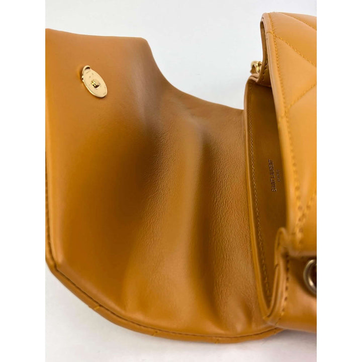 Inside view of the Saint Laurent Calfskin Quilted Toy Loulou Yellow Crossbody Bag showing smooth leather finish.