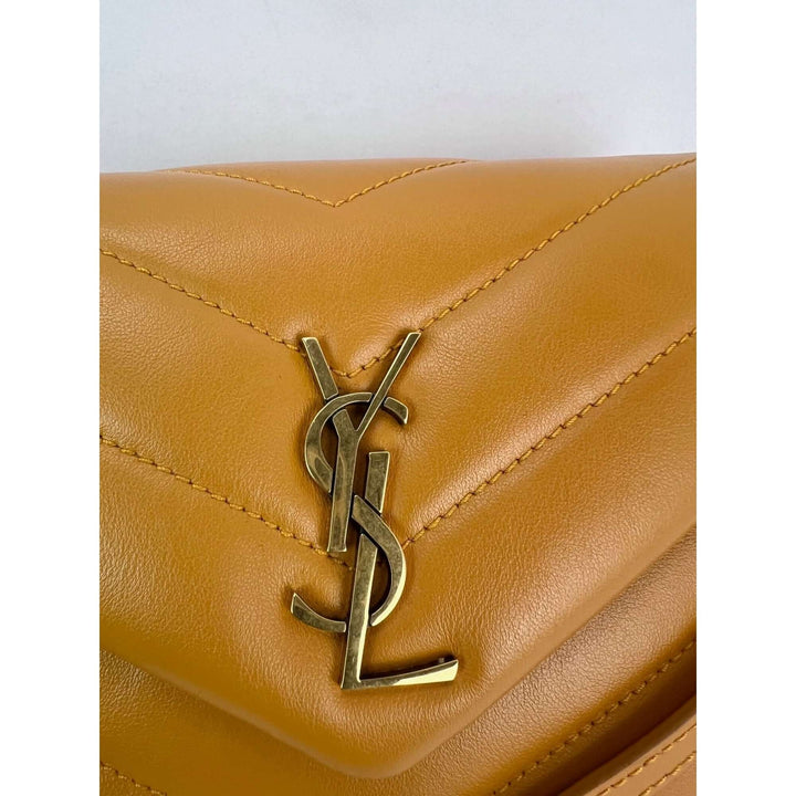 Close-up of the YSL logo on the Saint Laurent Calfskin Quilted Toy Loulou Yellow Crossbody Bag, luxury bags detail.