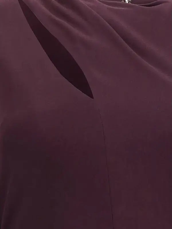Close-up of a dark purple fabric with a cutout design.