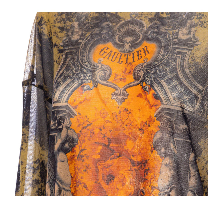 Fabric with intricate design and 'Gaultier' branding on a white background
