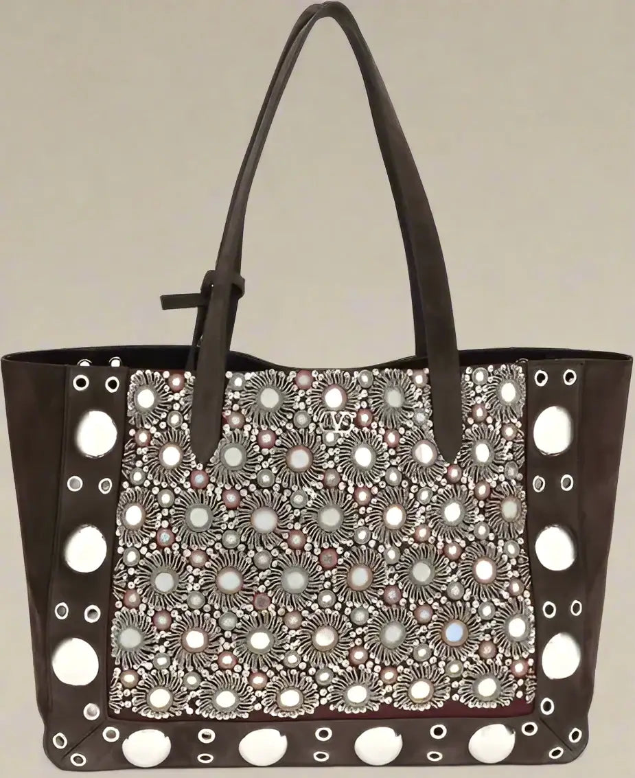 Brown handbag with decorative pattern on a white background