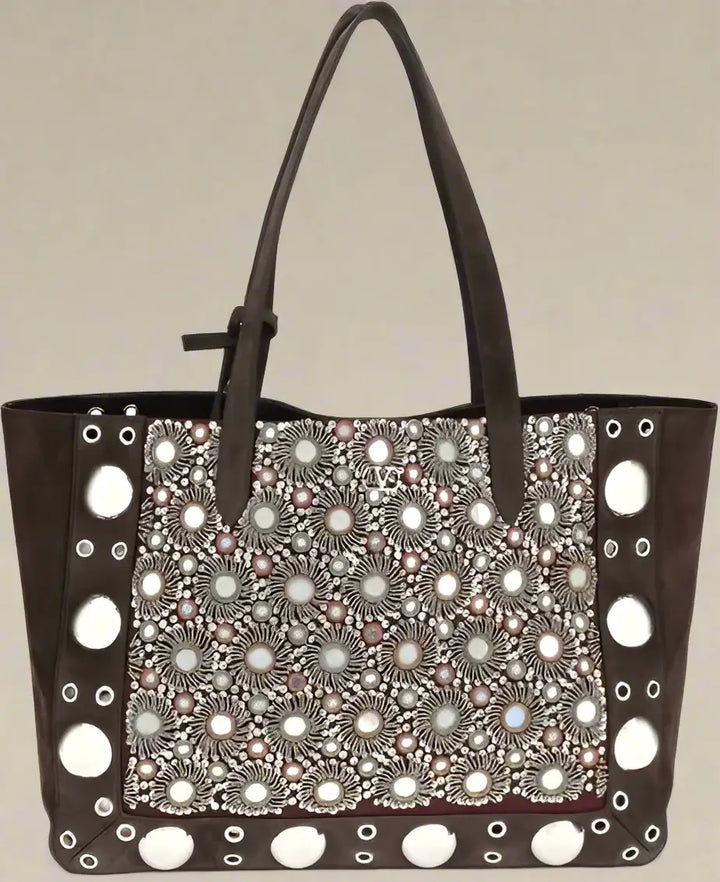 Brown handbag with decorative pattern on a white background