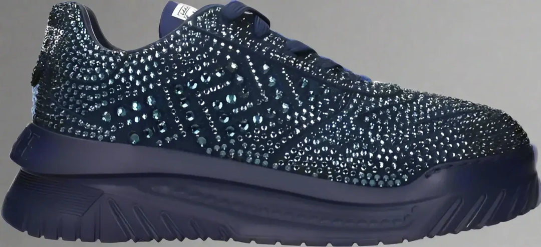 Navy blue sneaker with rhinestone embellishments on a white background