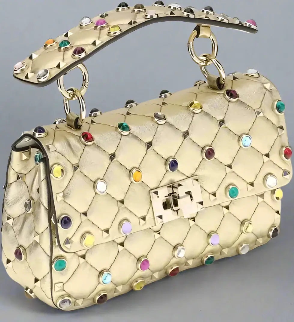 Beige handbag with colorful gemstones on a white background