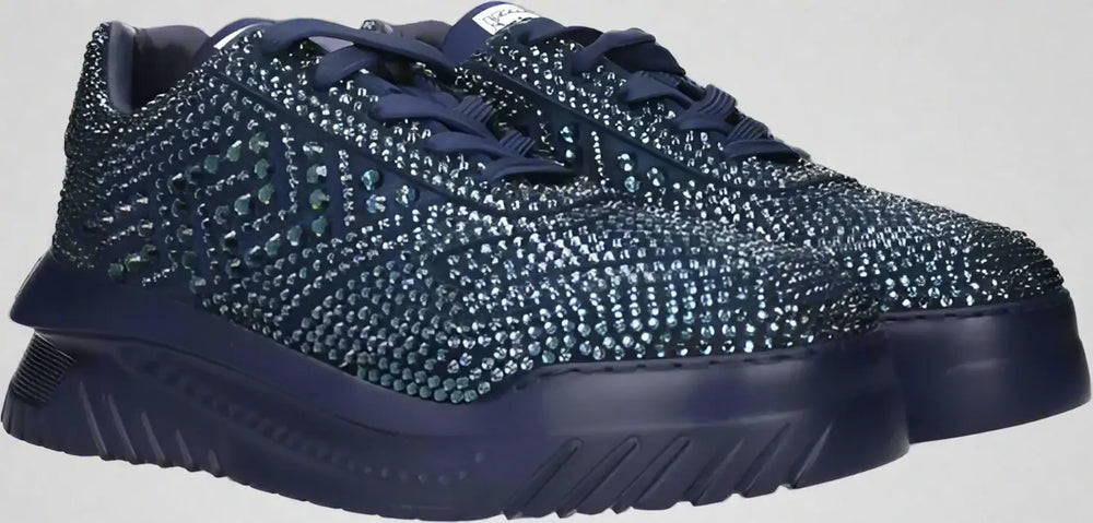 Navy blue sneakers with rhinestone embellishments on a white background