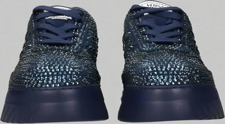 Navy blue sneakers with textured design on a white background