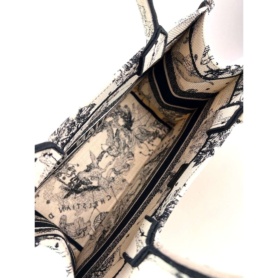 Interior view of Christian Dior Book Embroidered Canvas Medium Stars and Signs Black Tote detailing fabric design.