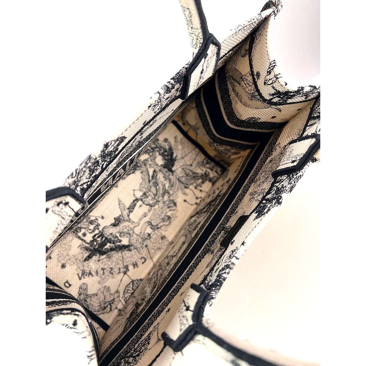 Interior view of Christian Dior Book Embroidered Canvas Medium Stars and Signs Black Tote detailing fabric design.