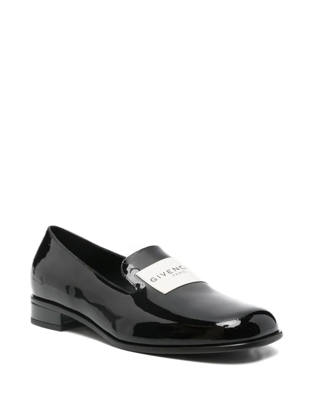 Black patent leather shoe with Givenchy logo on a white background