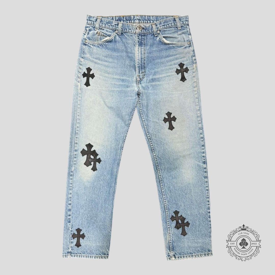 Chrome Hearts Levis Cross Patch Jeans in light wash featuring rare cross patches, a must-have for luxury denim enthusiasts.