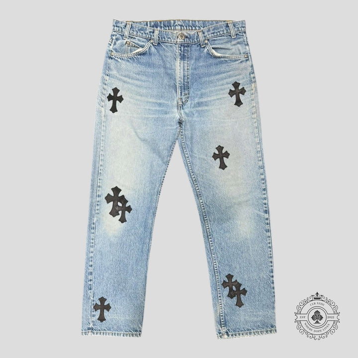 Chrome Hearts Levis Cross Patch Jeans in light wash featuring rare cross patches, a must-have for luxury denim enthusiasts.