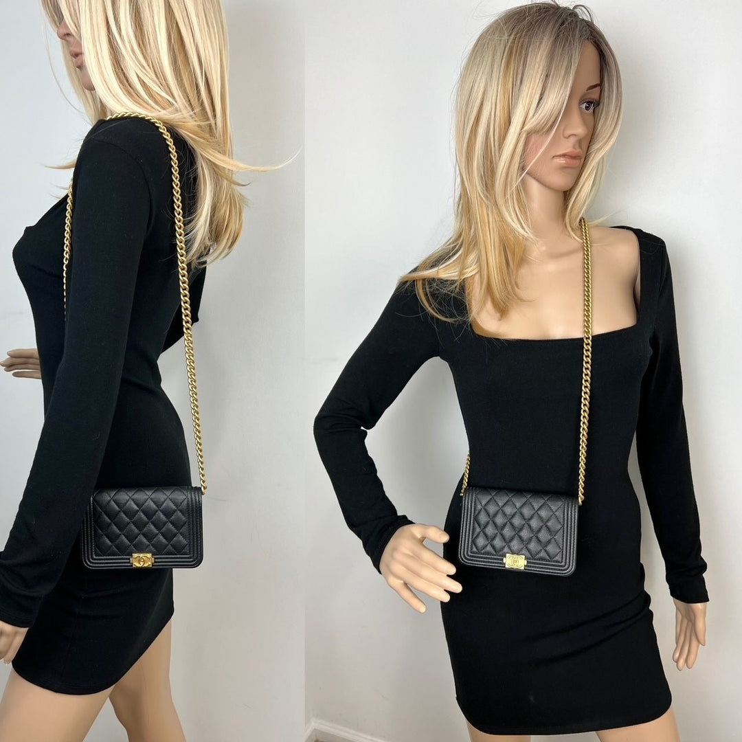 Chanel Caviar Quilted Mini Boy Clutch Wallet on a Chain Black worn by mannequin with stylish outfit, showcasing luxury bags.