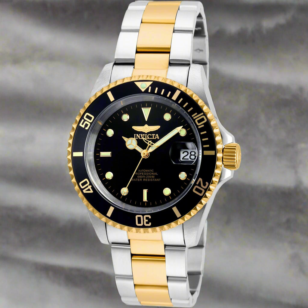 INVICTA Pro Diver men's watch with stainless steel band INVICTA black graphic t-shirt with logo front Gold-tone INVICTA chronograph wristwatch close-up INVICTA men's button-down shirt with embroidered detail INVICTA oversized sport watch and branded appar