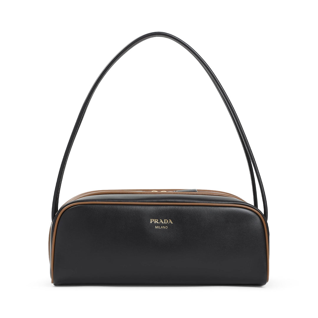Black Prada handbag with a brown accent on a white background