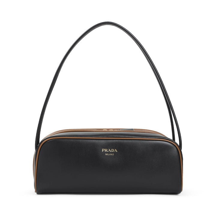 Black Prada handbag with a brown accent on a white background