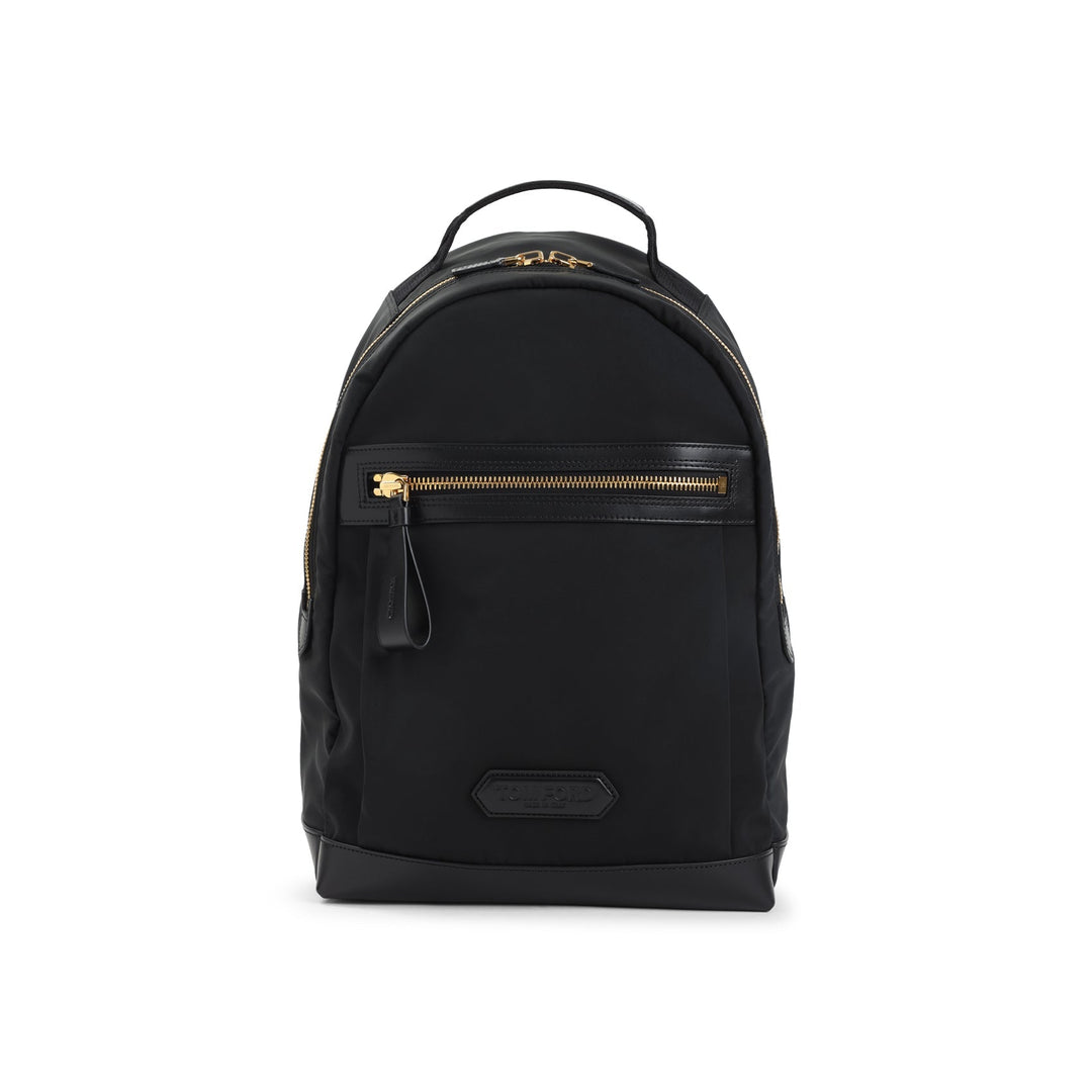 Black backpack with gold zipper on a white background