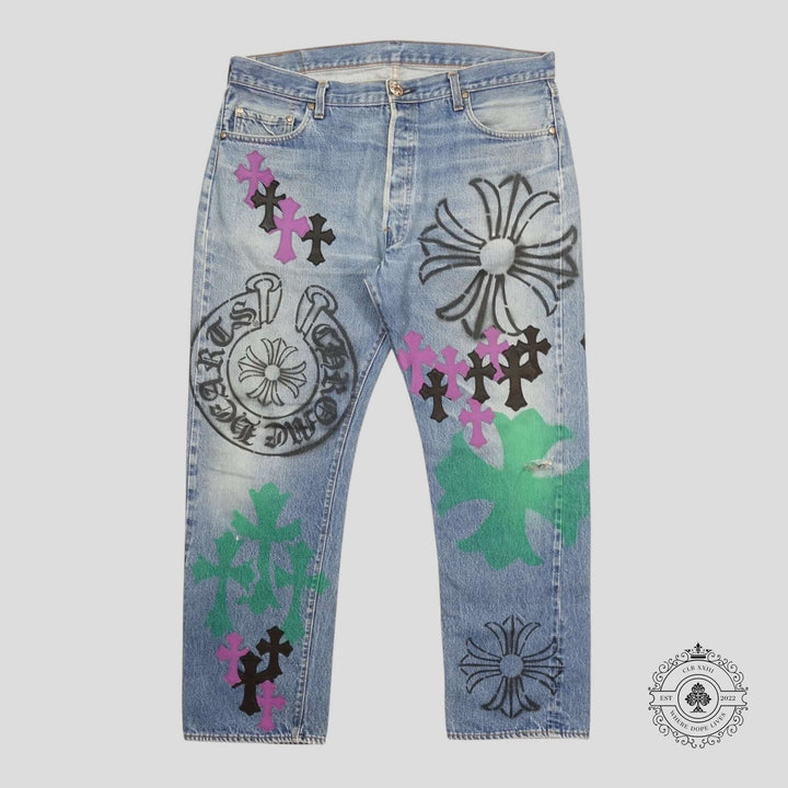 Chrome Hearts Stencil Cross Patch Jeans featuring unique black and purple patches on luxury denim.