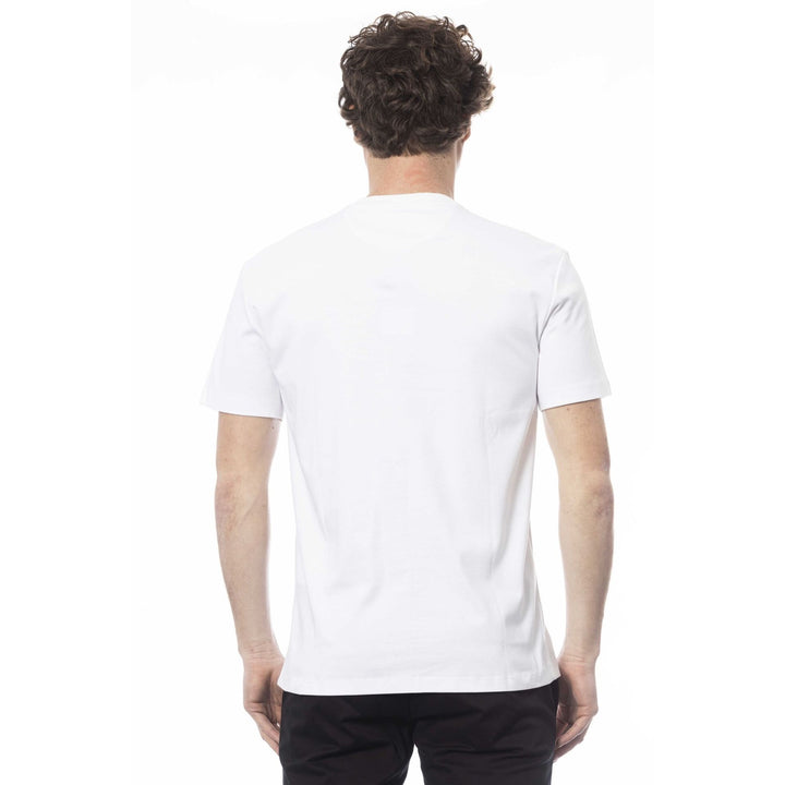 A man wearing a white Trussardi t-shirt with a geometric pattern on the front.
