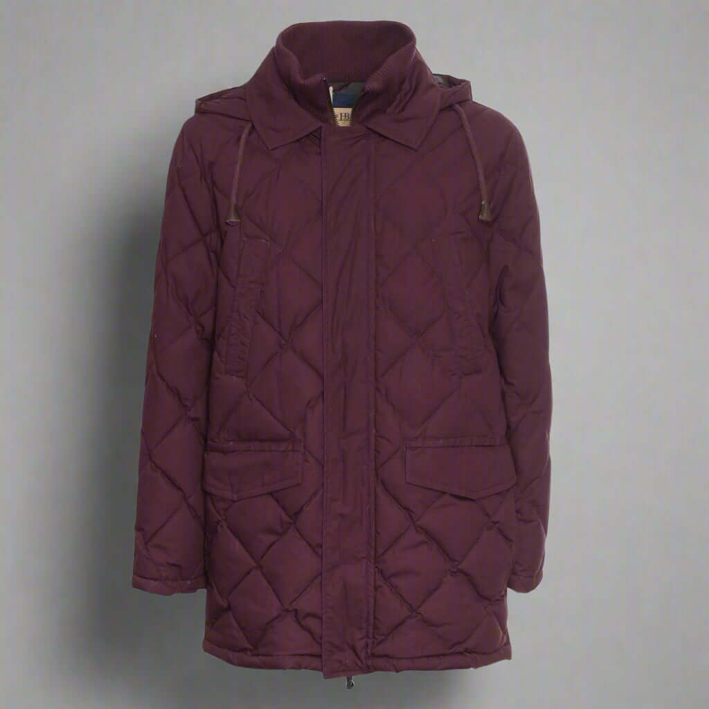Maroon quilted jacket on a white background