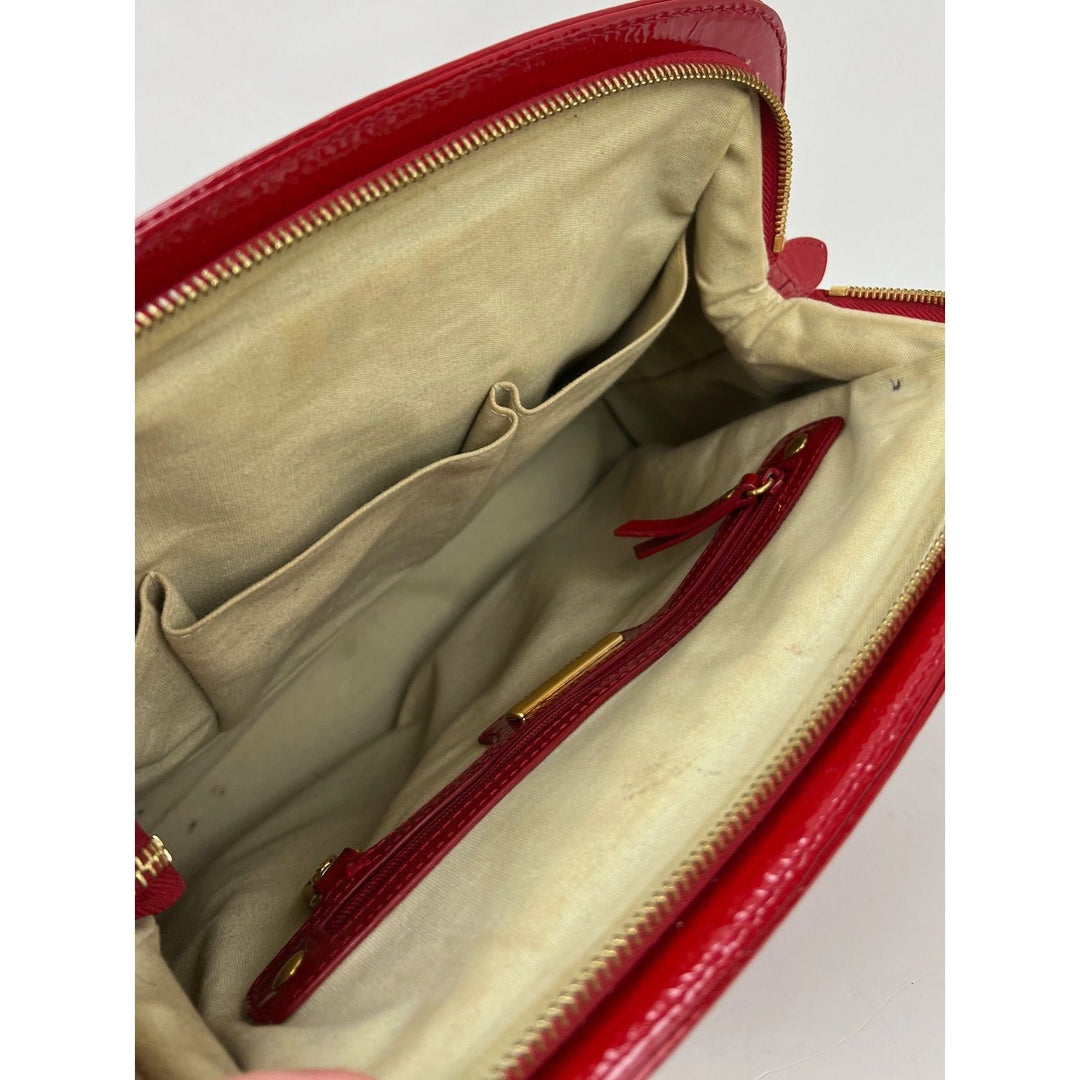 Interior view of Isabella Fiore Red Patent Leather Hand bag showing spacious design and storage pockets.