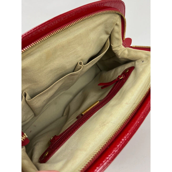 Interior view of Isabella Fiore Red Patent Leather Hand bag showing spacious design and storage pockets.