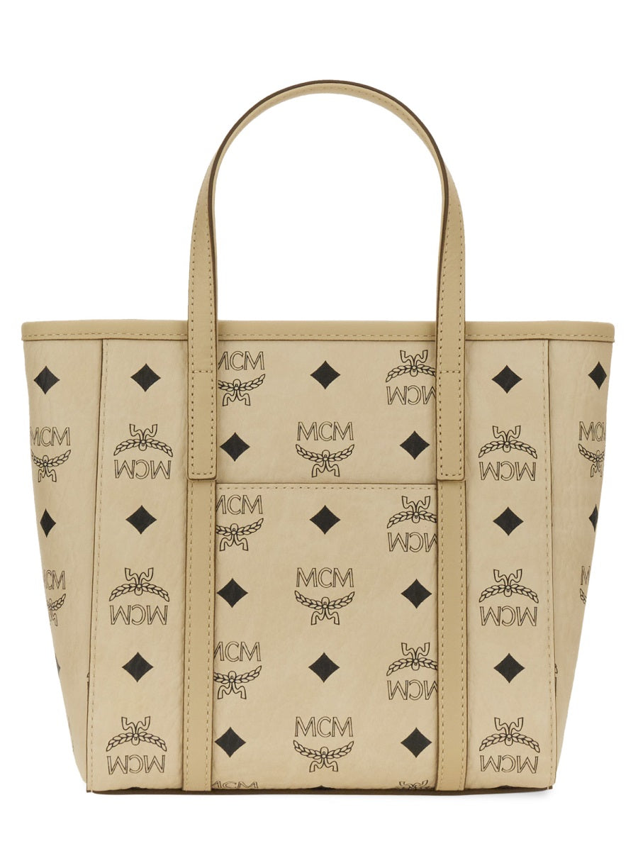 Beige tote bag with black pattern on a white background
