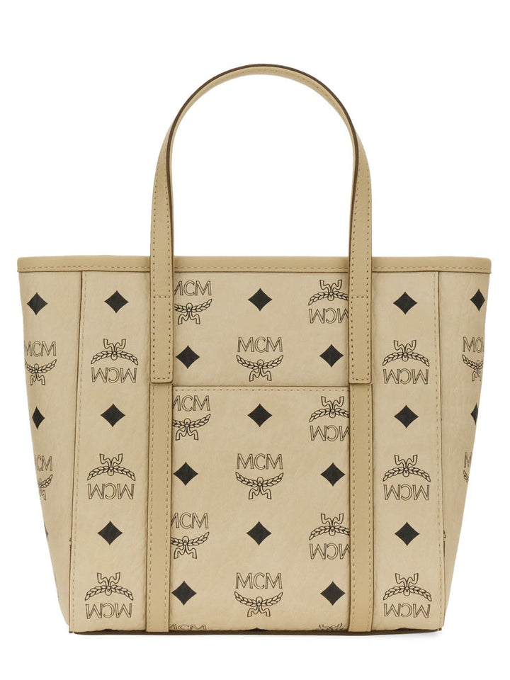 Beige tote bag with black pattern on a white background