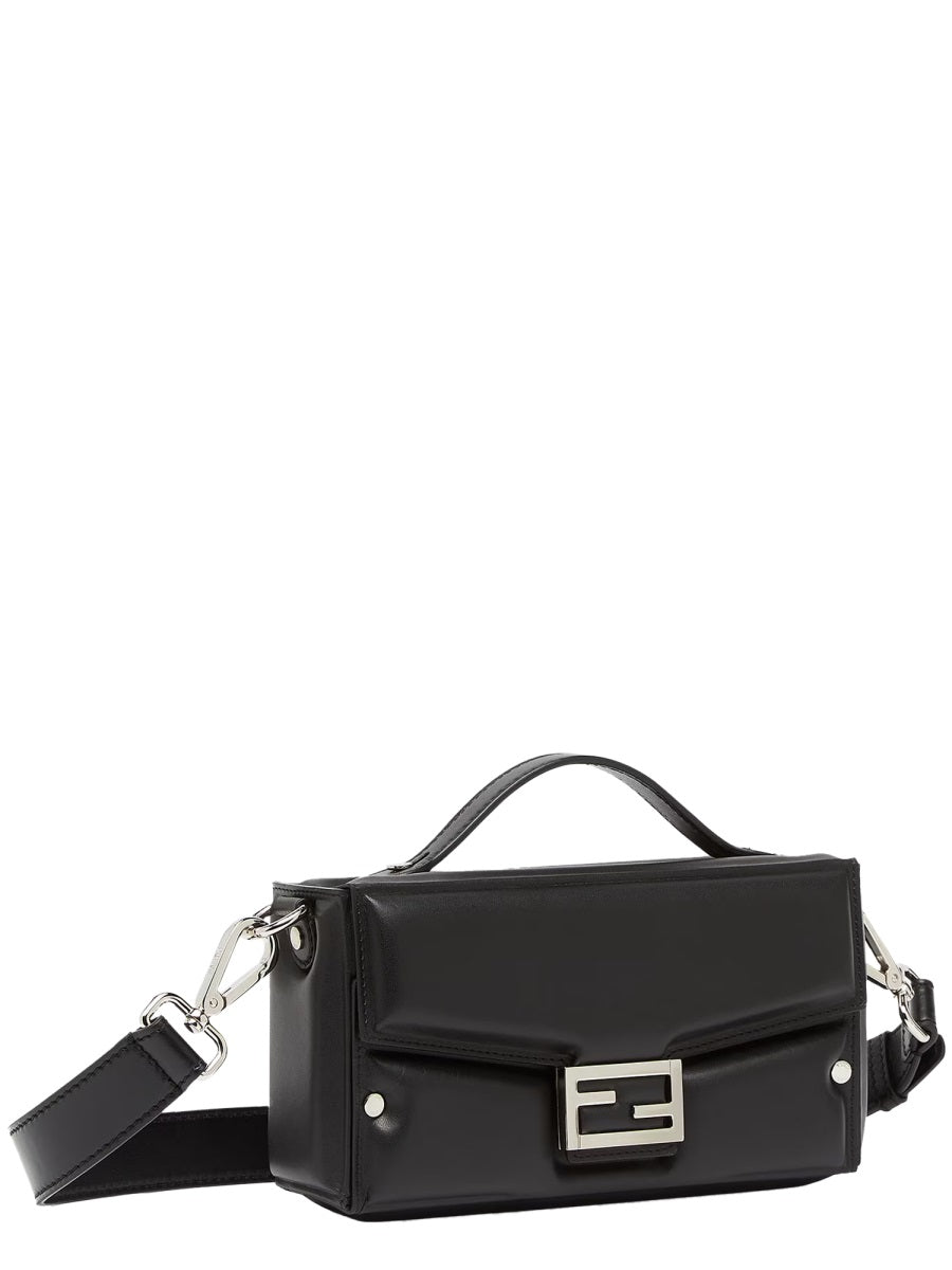 Black handbag with a silver logo on a white background