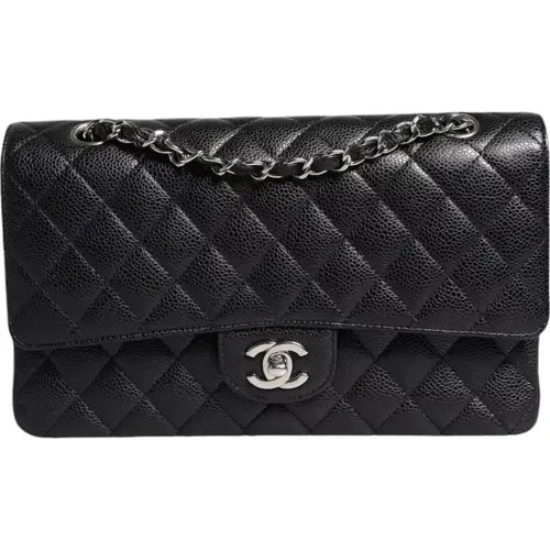Preloved CHANEL classic quilted handbag front view Authentic CHANEL black leather flap bag CHANEL gold chain shoulder bag – preloved Vintage CHANEL logo clutch purse Secondhand CHANEL luxury tote with dust bag