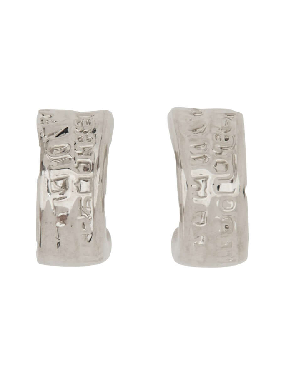 Silver earrings with textured design on a white background