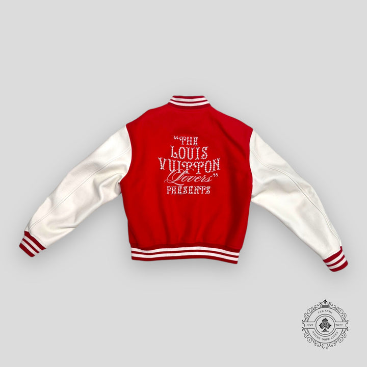 Red and white varsity jacket with text on the back against a gray background